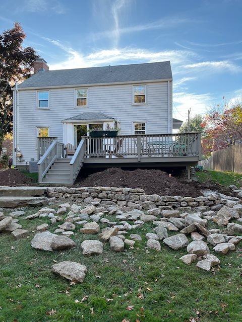 Back of house with stones