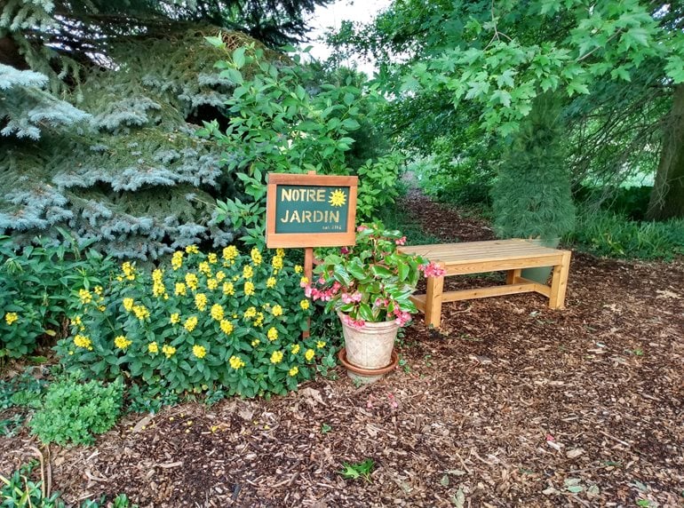 Garden bench with sign